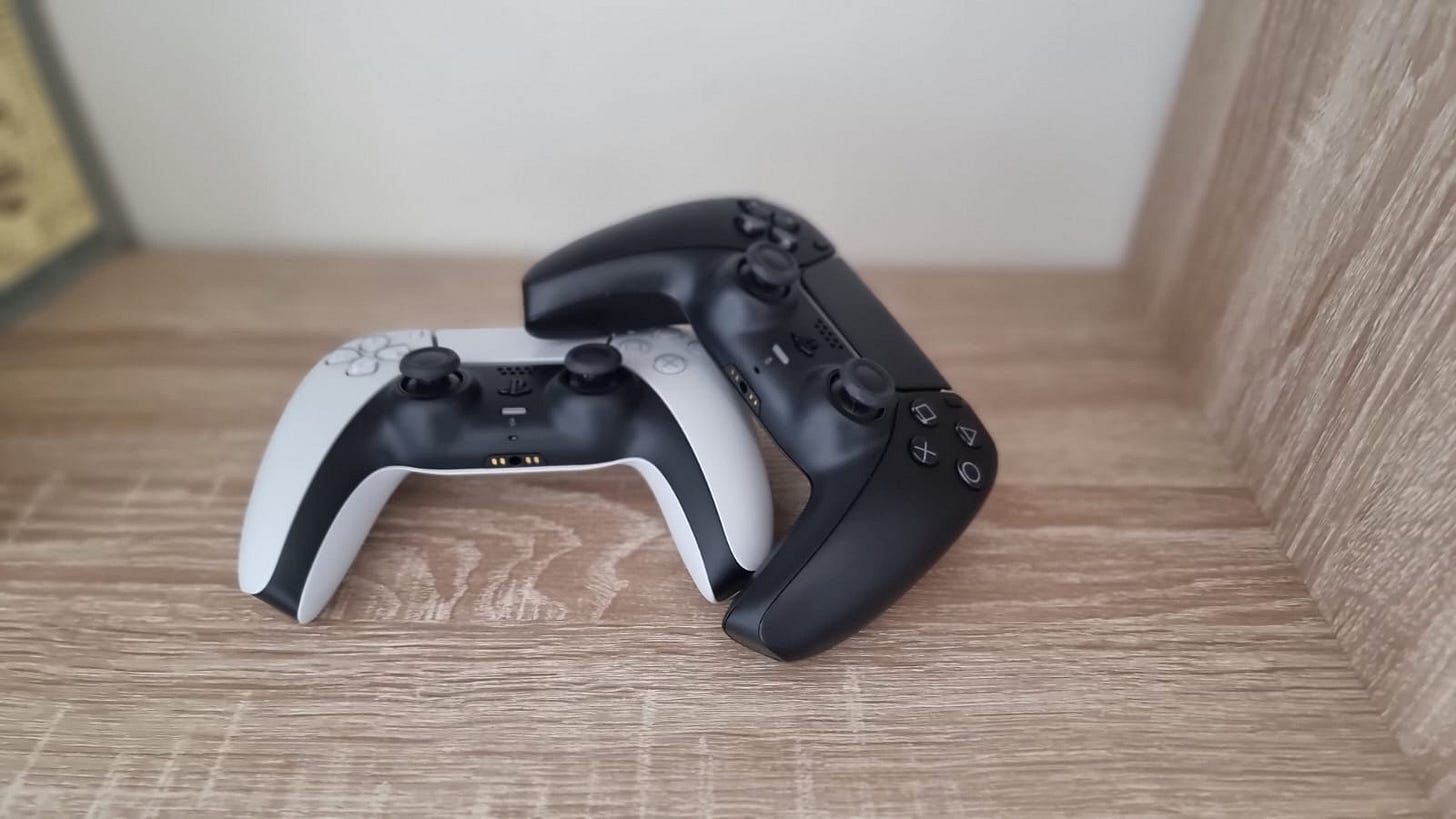 White and Midnight Black DualSense controller White and Midnight Black DualSense controller