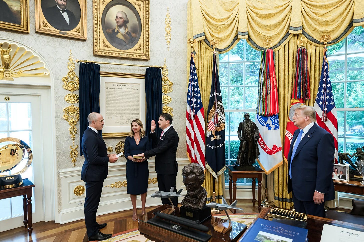 May be an image of the Oval Office and text