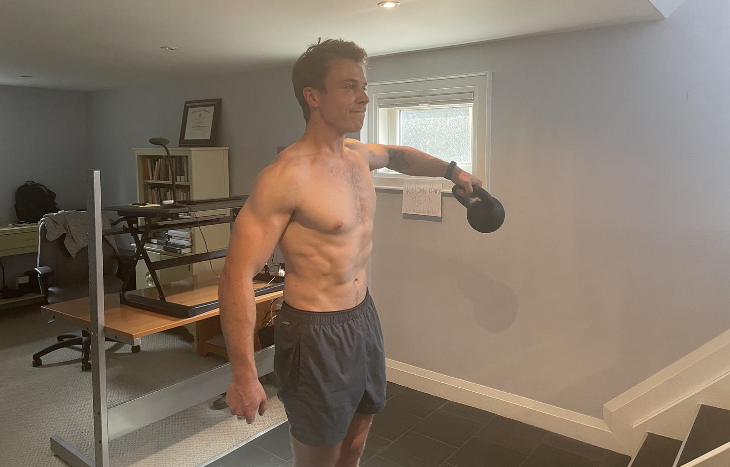 Doing lateral raises in my basement gym/office (I didn’t ask for this photo to be taken — I’m not that vain). Doing lateral raises in my basement gym/office (I didn’t ask for this photo to be taken — I’m not that vain).