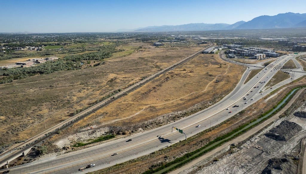 (Francisco Kjolseth | The Salt Lake Tribune) The Austin Townhomes, part of the Veranda West project in Draper, above right, are pictured on Wednesday, June 17, 2026. A new 8.8-acre surf park was recently approved by the Draper City Council in a decision to amend the master plan for the new development, set for the space between the FrontRunner tracks and Bangerter Highway west of I-15 in Draper. (Francisco Kjolseth | The Salt Lake Tribune) The Austin Townhomes, part of the Veranda West project in Draper, above right, are pictured on Wednesday, June 17, 2026. A new 8.8-acre surf park was recently approved by the Draper City Council in a decision to amend the master plan for the new development, set for the space between the FrontRunner tracks and Bangerter Highway west of I-15 in Draper.