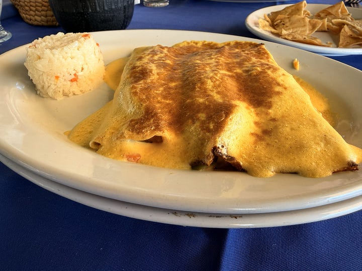 Coconut milk, octopus, seafood crepes, and the view of the beach at La Cabaña in Acapulco