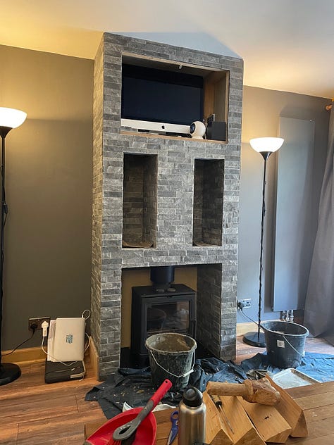 A nearly finished hearth and the outside kitchen is a quarter done.
