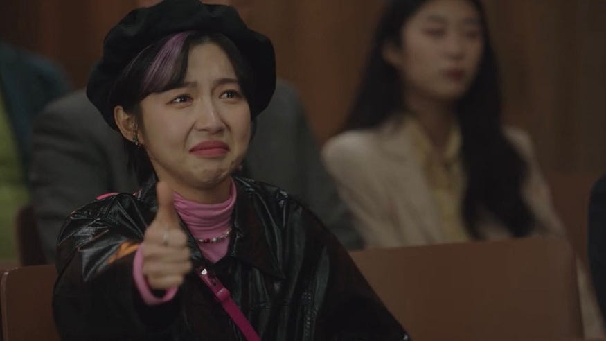 Dong Geu-Rami giving a thumbs up to Woo Young Woo