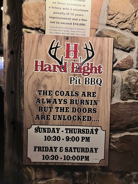 Hard Eight sign, grill, and trays with food
