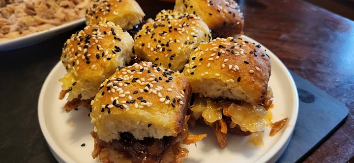 Five photos: dinner rolls topped with black and white sesame seeds; a dinner roll being pulled apart by two hands to show the flaky center; a roll cut in half with fig jam on one side and salmon salad on the other; a roll topped with BBQ chicken and caramelized onion jam; and a finished BBQ slider