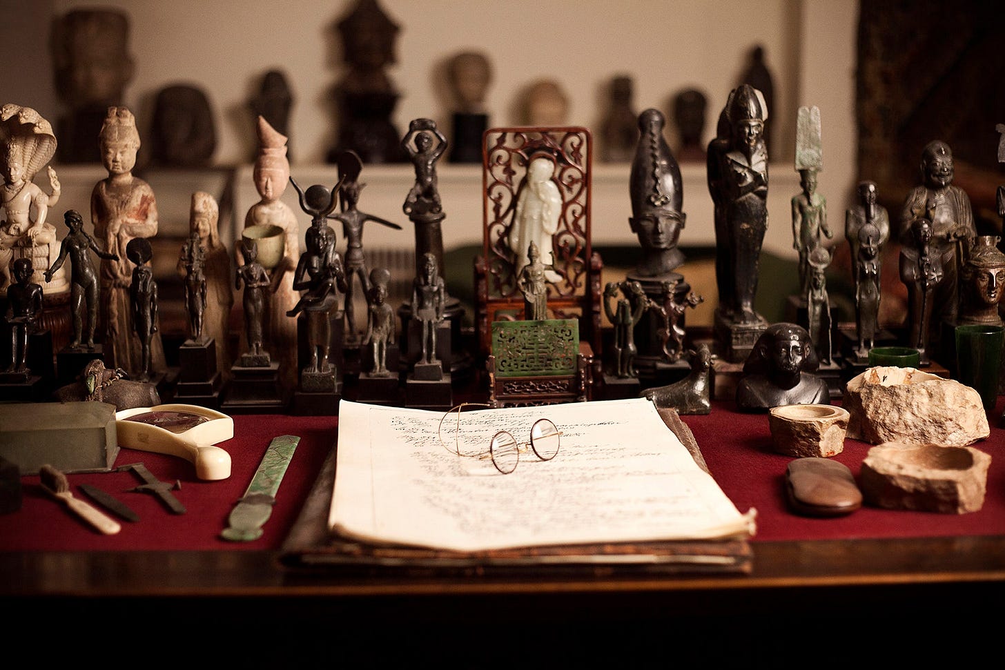 Spectacles on a desk surrounded by captions.