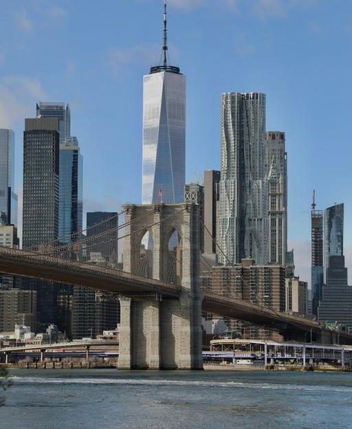 May be an image of skyscraper and the Brooklyn Bridge