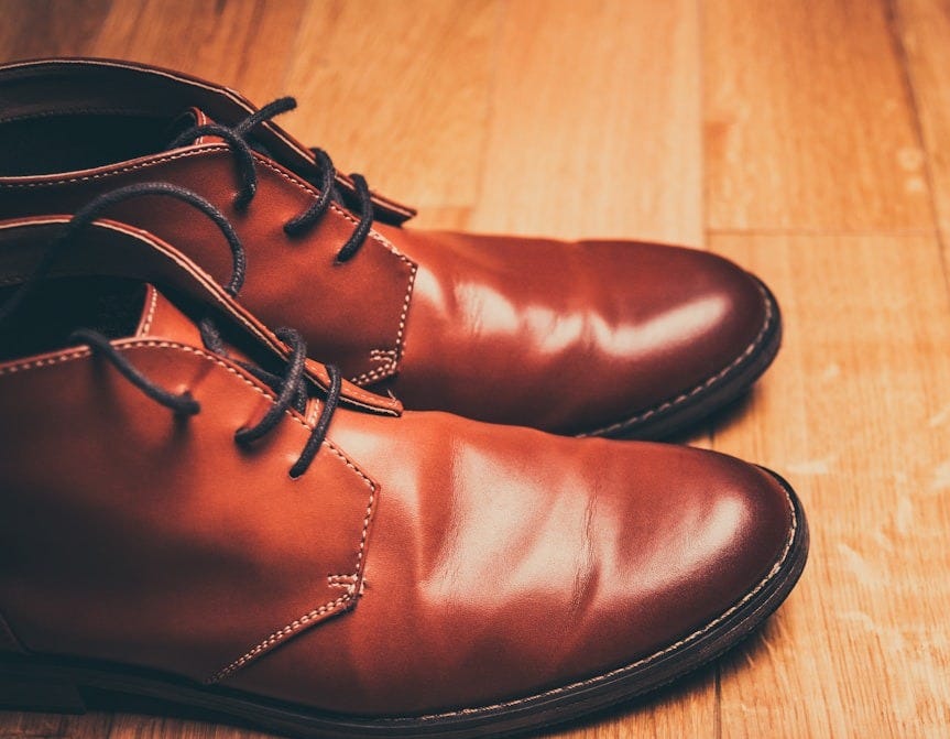 pair of brown leather lace-up boots pair of brown leather lace-up boots