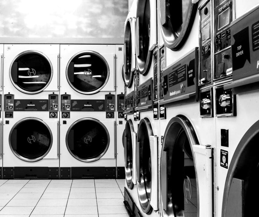 white washer and dryer laundry centers on white floor tiles white washer and dryer laundry centers on white floor tiles