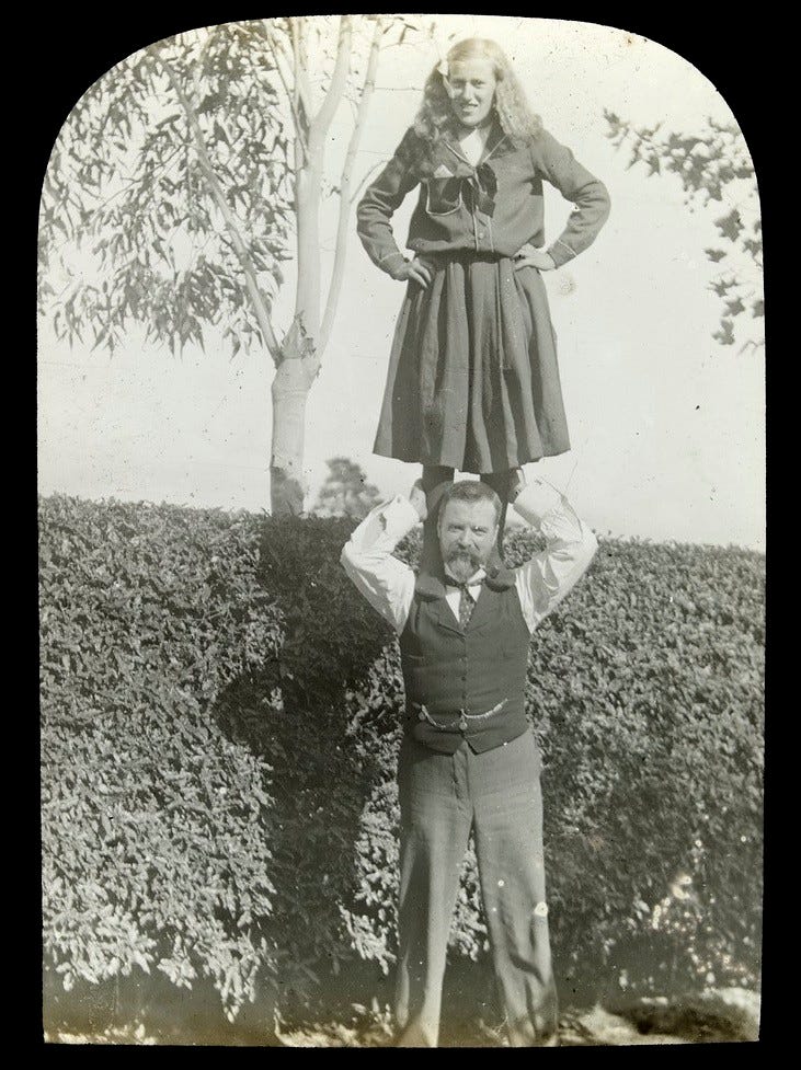 Girl standing on man's shoulders, possibly at Princes Cour… | Flickr