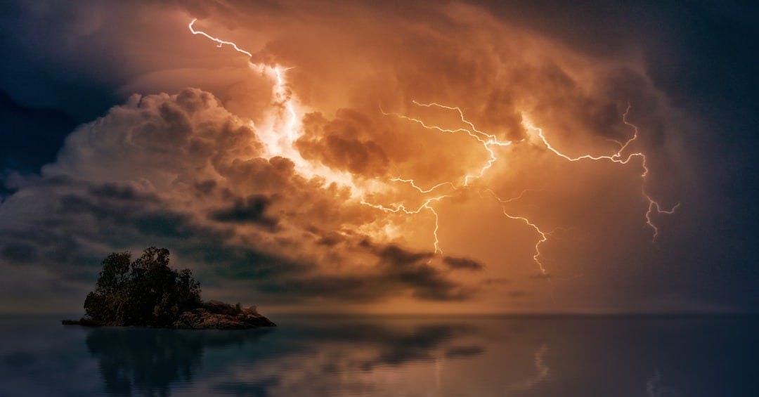 photo of island and thunder