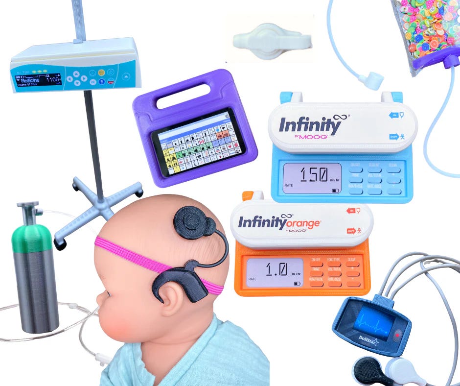 A flat lay of Butterfly Pig miniature medical toys including two Infinity by Moog feeding pumps in blue and orange, a doll-sized IV drip stand, oxygen tank, cochlear implant headset on a baby doll, AAC communication device, pulse oximeter, and a colourful button bag on a white background.
