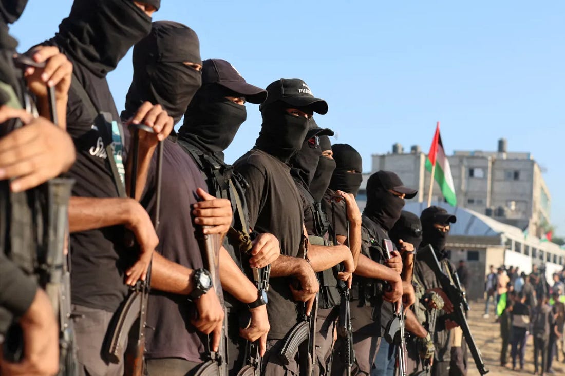 Palestinian militants standing guard in Khan Younis, southern Gaza Strip, October 2025