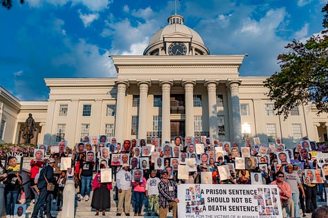 Citizens gather for a vigil to remember loved ones who have died in Alabama's prisons