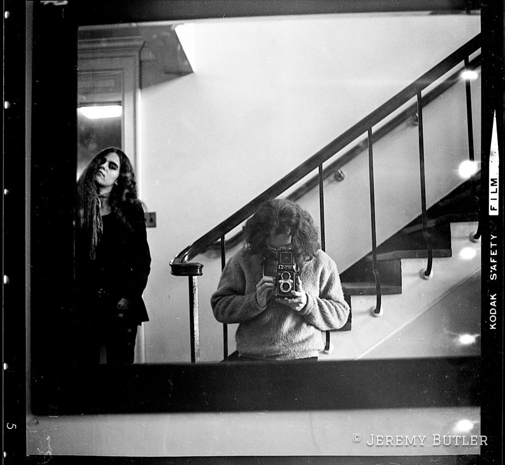 a Brown University student takes a self-portrait in a mirror