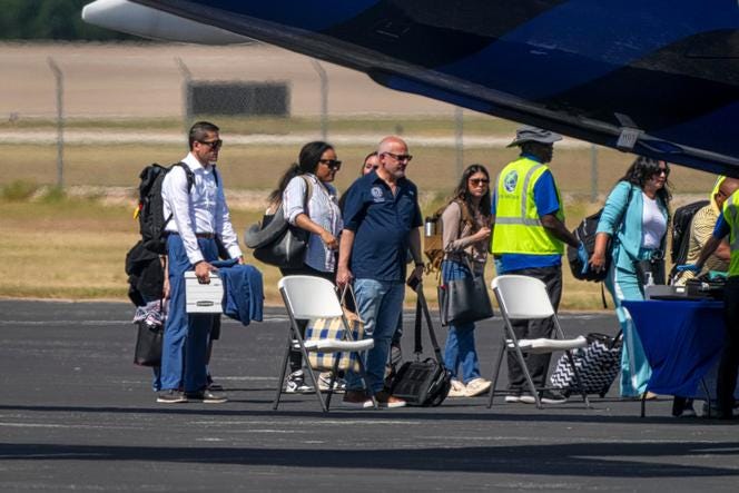 Texas Rep. Gene Wu, left, and other Democratic lawmakers board a plane, on Aug. 3, 2025, in Austin, Texas. 