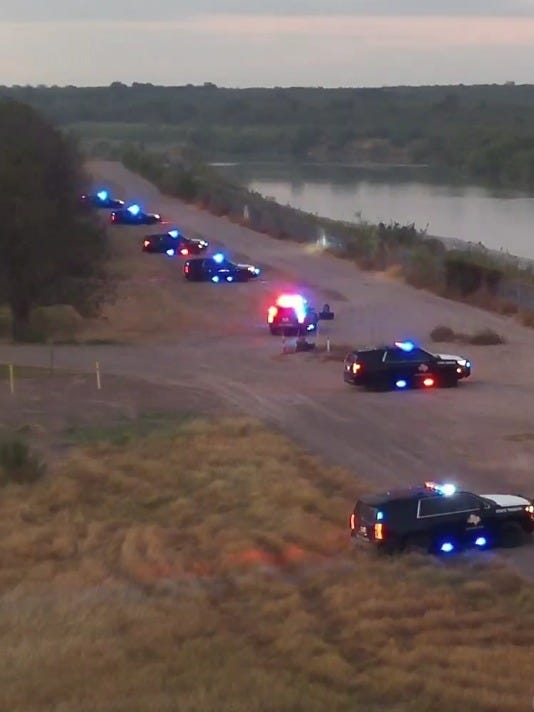 Texas DPS vehicles alongside the Rio Grande Texas DPS vehicles alongside the Rio Grande