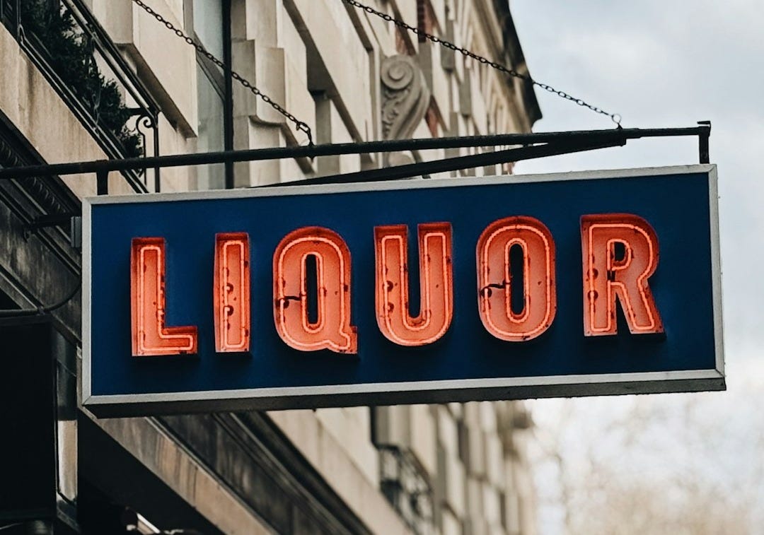 Liquor store sign with neon lights.