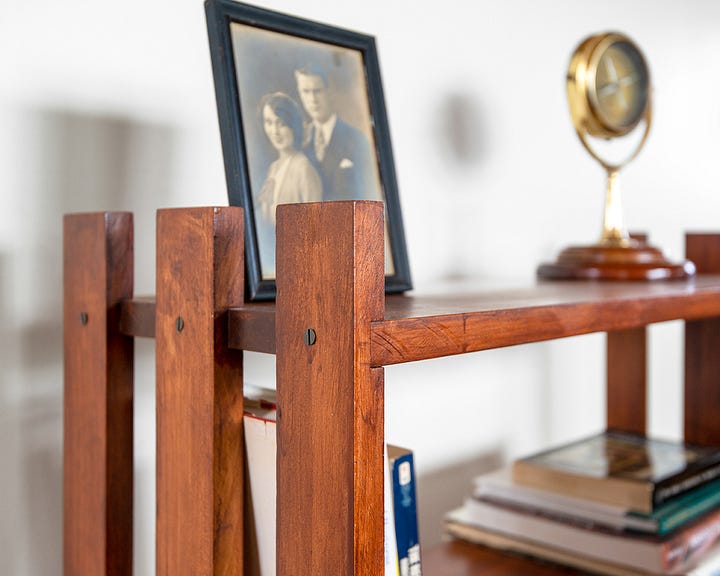 two simple arts and craft style bookshelves, one shot straight on and one joinery detail angle 