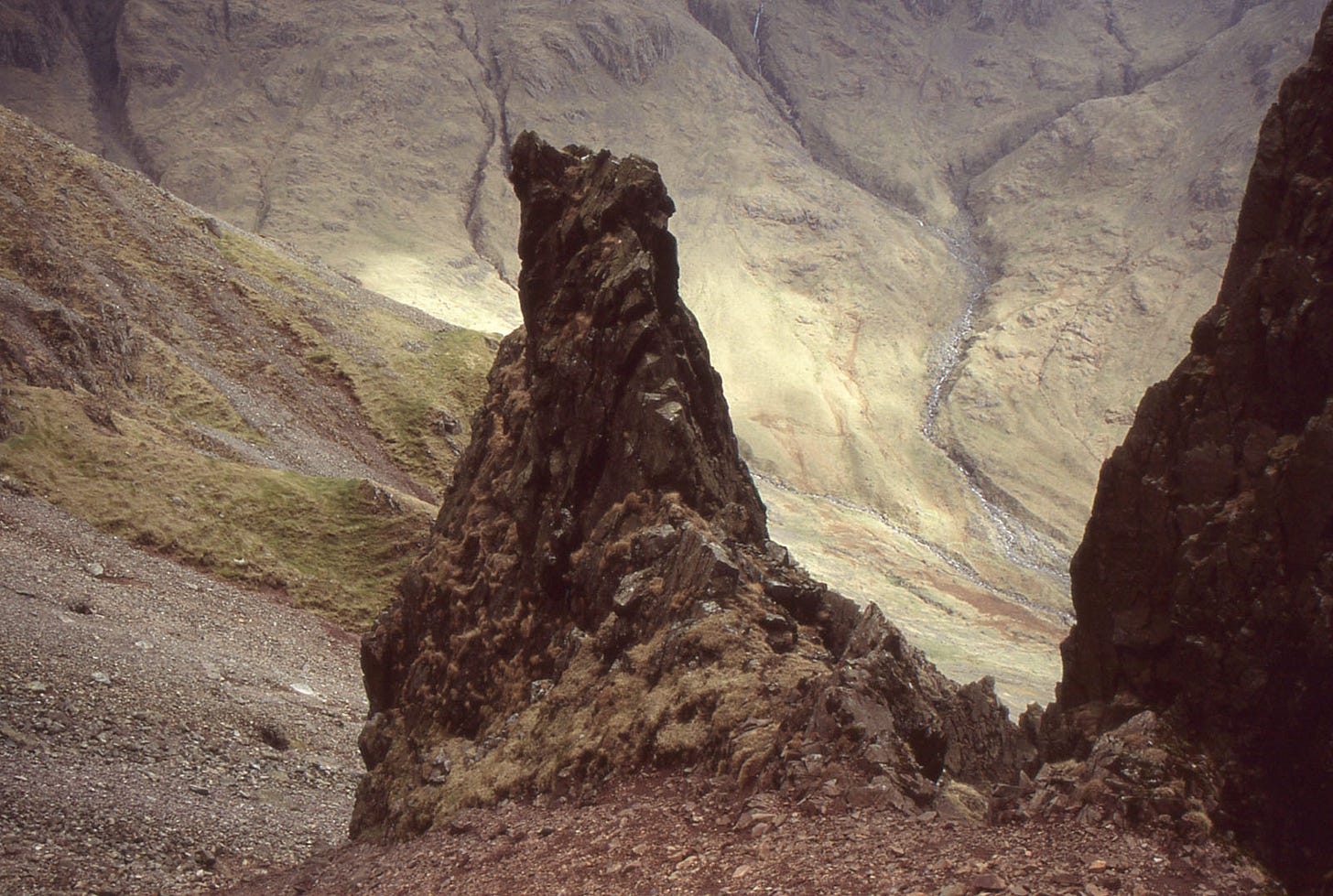 rocky tower in brown landscape