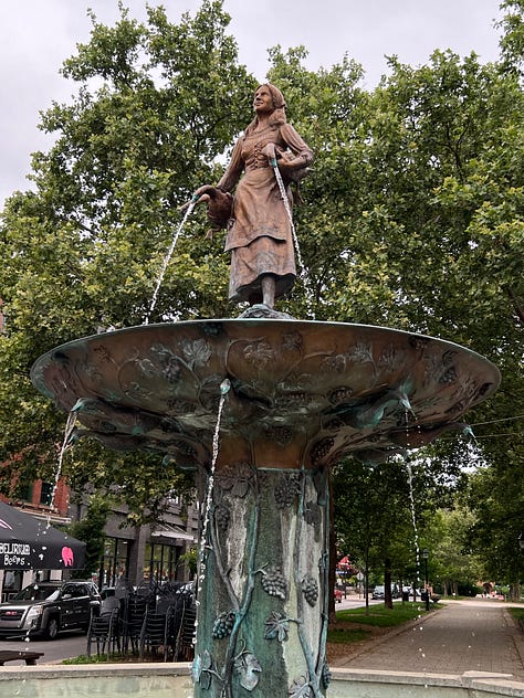 Mural on Rosie's Social Club, Glockenspeil at Goebel Park, Goose Girl Fountain, Street sign reflecting WWII anti-German changes, statuary detail at Mother of God church, Mural of Mainstrasse, Cathedral Basilica, Strasse Haus