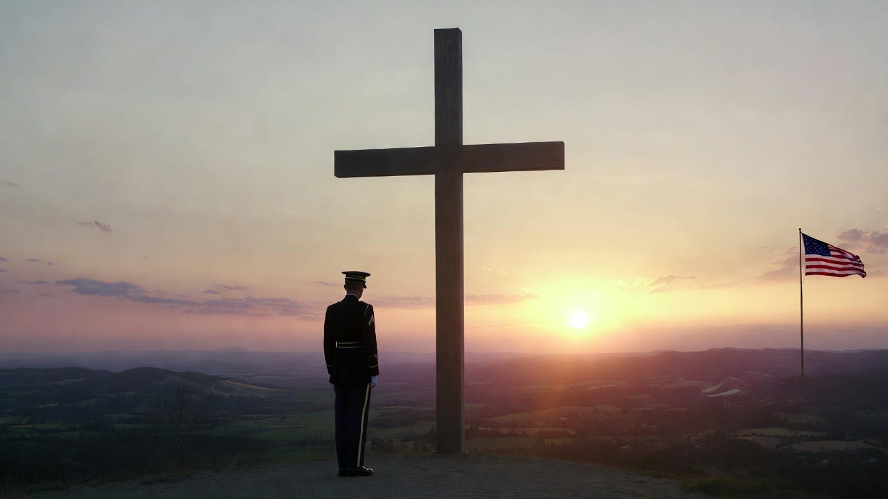 A United States Army soldier in dress uniform standing at attention before a large wooden cross at sunrise with an American flag and rolling hills in the background.