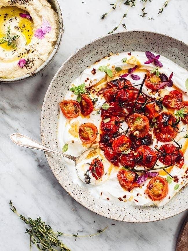 Ottolenghi's Hot charred tomatoes with cold yoghurt from the cookbook Simple Ottolenghi's Hot charred tomatoes with cold yoghurt from the cookbook Simple