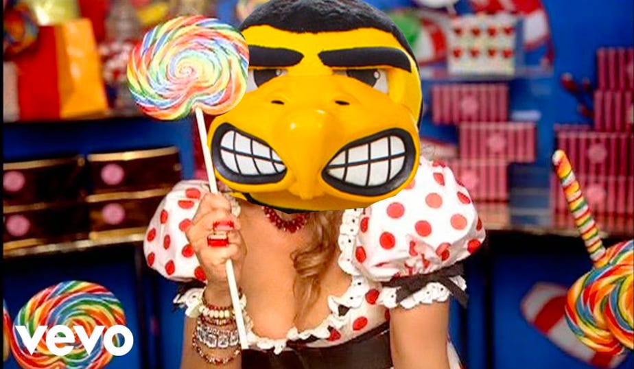Herky's head superimposed over Fergie's in a still from Fergie's music video for Fergalicious
