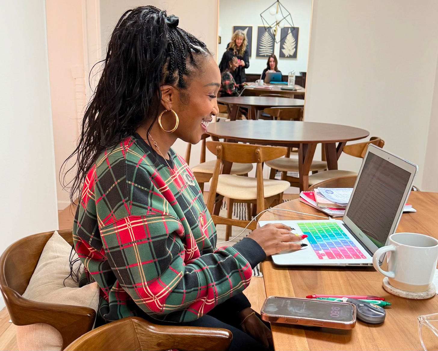 Shaunda Necole writing at her laptop in a creative workspace while developing ideas about Generative Engine Optimization (GEO), illustrating a founder building expertise and thought leadership in the evolving era of AI search and digital discovery.