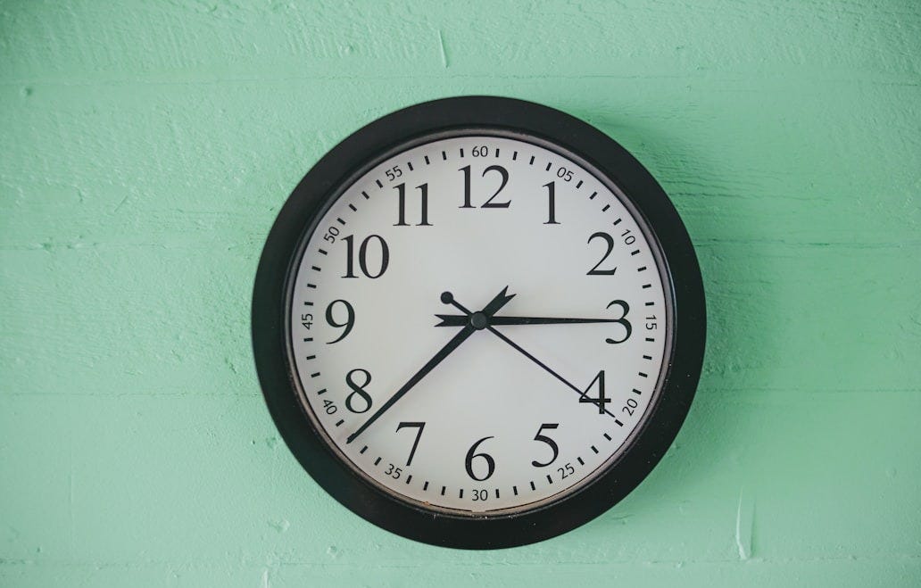 black and white analog wall clock at 10 00 black and white analog wall clock at 10 00
