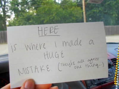 a gallery of photos which contain 17-year-old Ari's hand holding flashcards in front of various locations. each flashcard reads "this is where I..." and is completed with the memory associated with the location