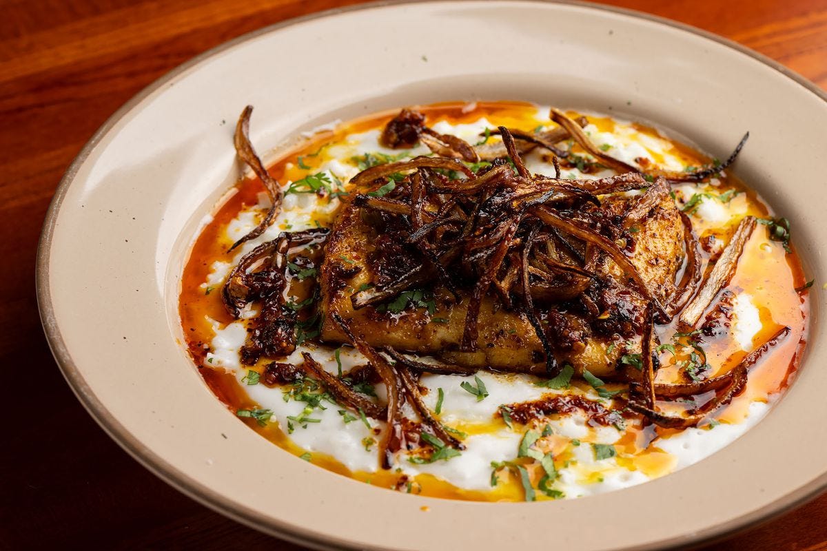 A seasoned fish dish with creamy stewed rice at Kurrypinch. A seasoned fish dish with creamy stewed rice at Kurrypinch.