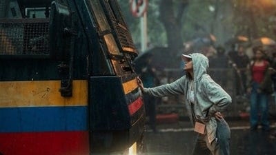 27-year-old Rhiya Ahir stops a Mumbai polica van during student protests.