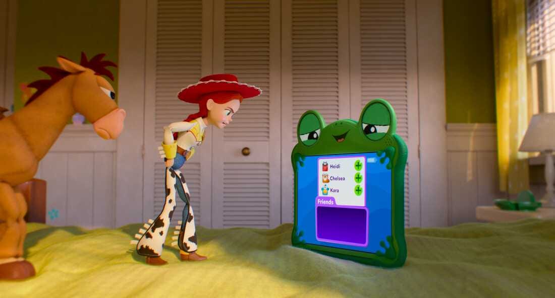 An animated scene from Toy Story 5 shows horse toy Bullseye, and cowgirl doll Jessie angrily confronting Lilypad, a tablet that looks like a frog.