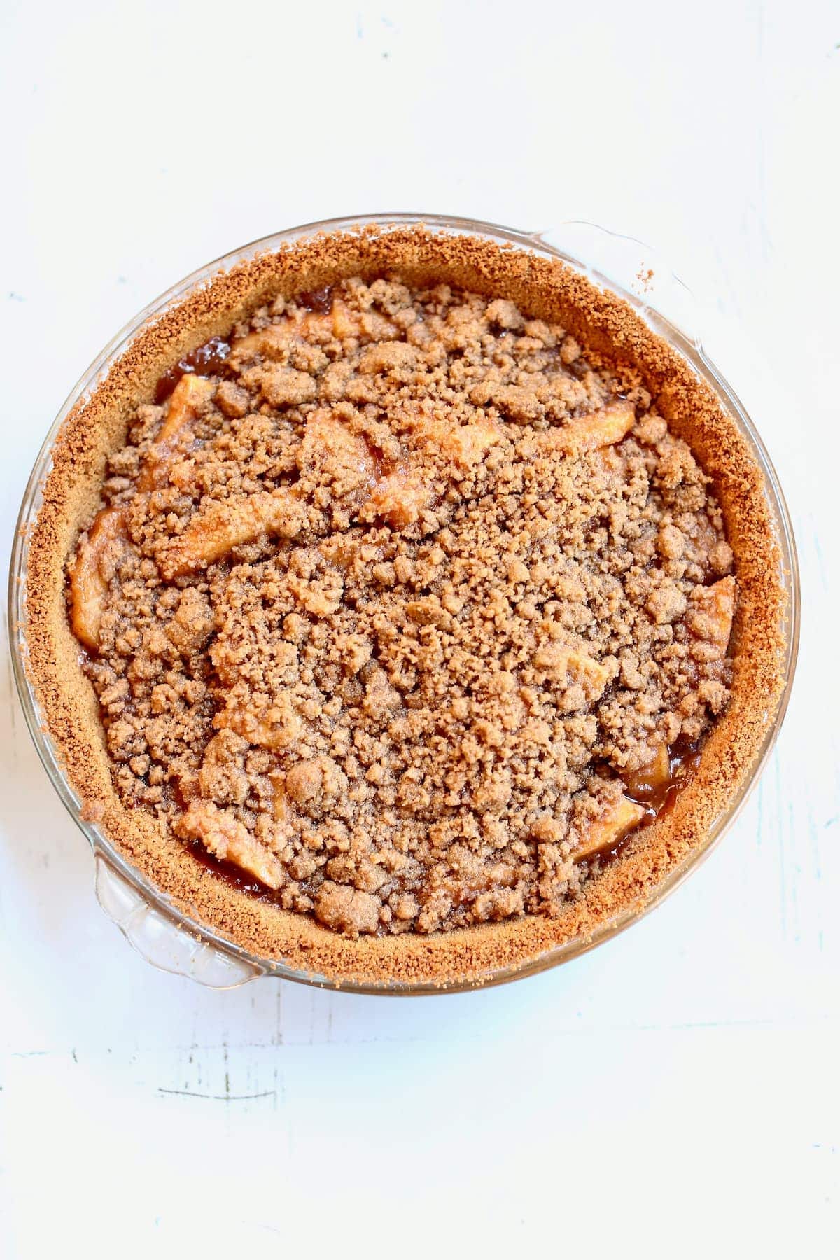 a cooked apple pie on a table.