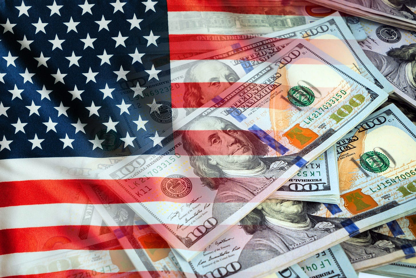 The American flag and U.S. dollars The American flag and U.S. dollars