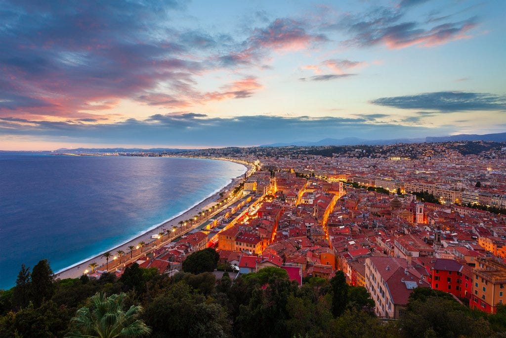 Nice Côte d’Azur coastline at sunset with panoramic view of the French Riviera and city lights Nice Côte d’Azur coastline at sunset with panoramic view of the French Riviera and city lights