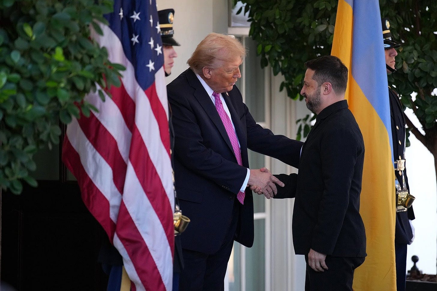 U.S. President Donald Trump greets Ukrainian President Volodymyr Zelensky at the White House.