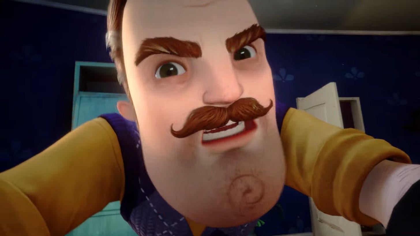 A man with a large chin and a moustache scowling at the camera