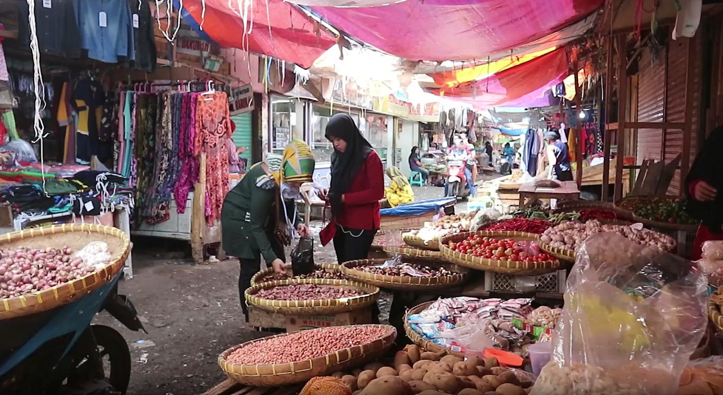 People in a market
Description automatically generated People in a market
Description automatically generated