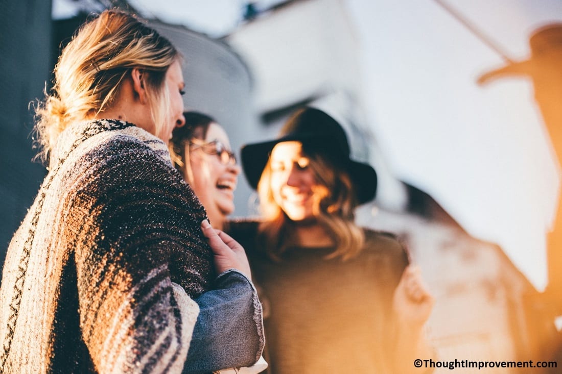 Women smiling, laughing, and talking.