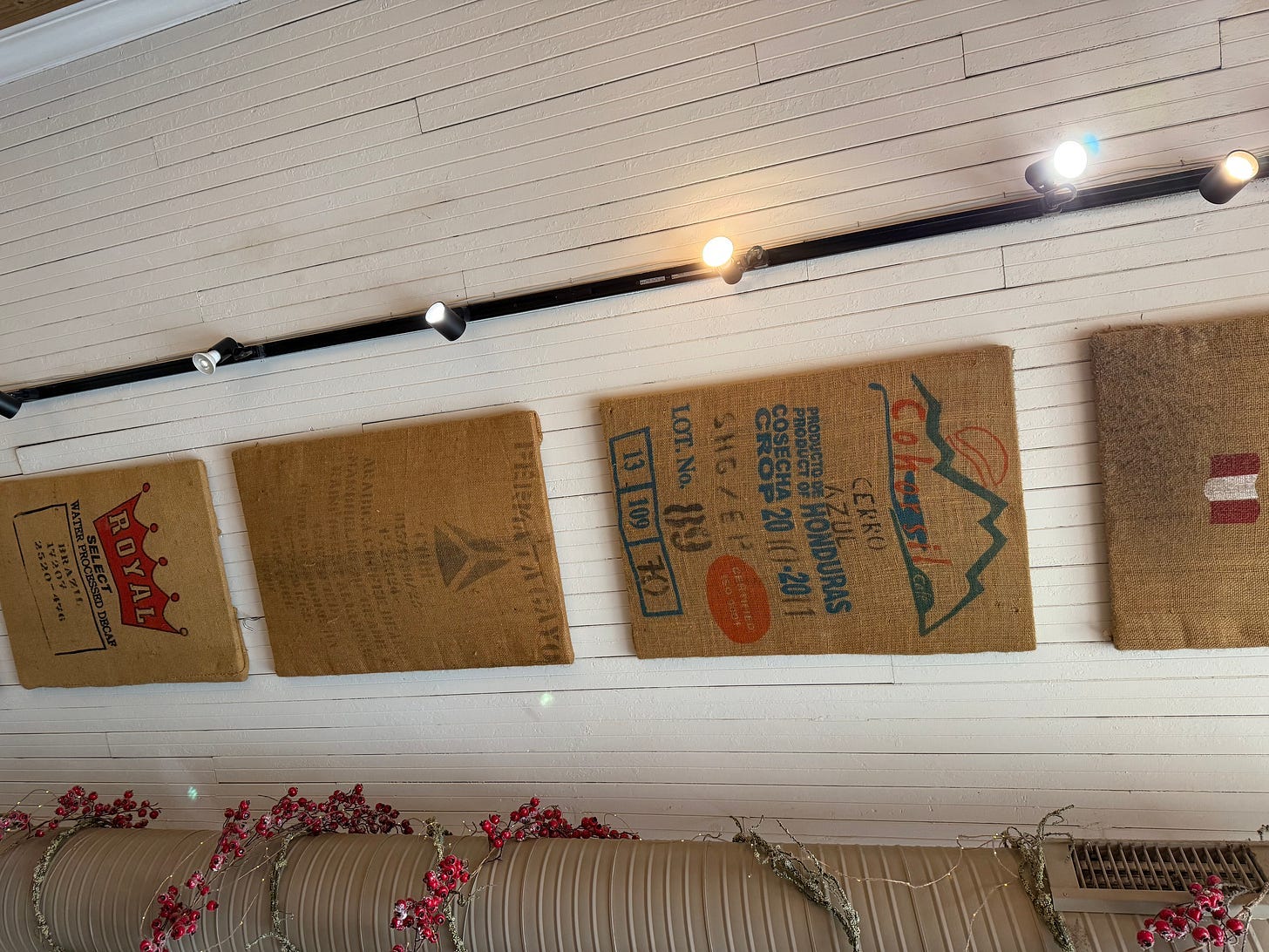A wall with a group of burlap mats

AI-generated content may be incorrect.