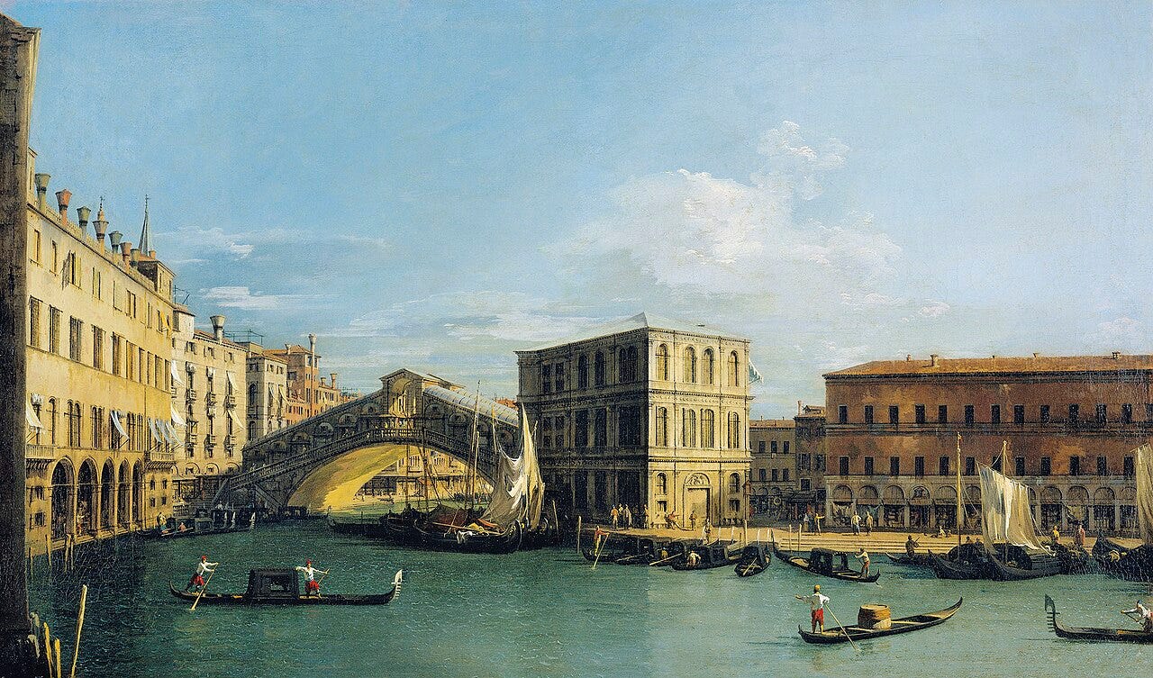 The stone arch of the Rialto Bridge over the Grand Canal The stone arch of the Rialto Bridge over the Grand Canal