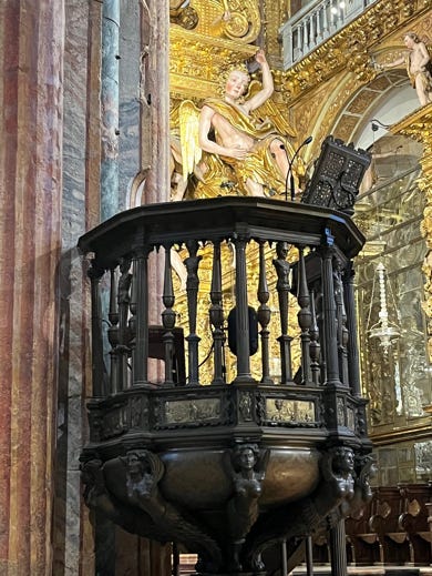 A statue of a person on a podium

Description automatically generated