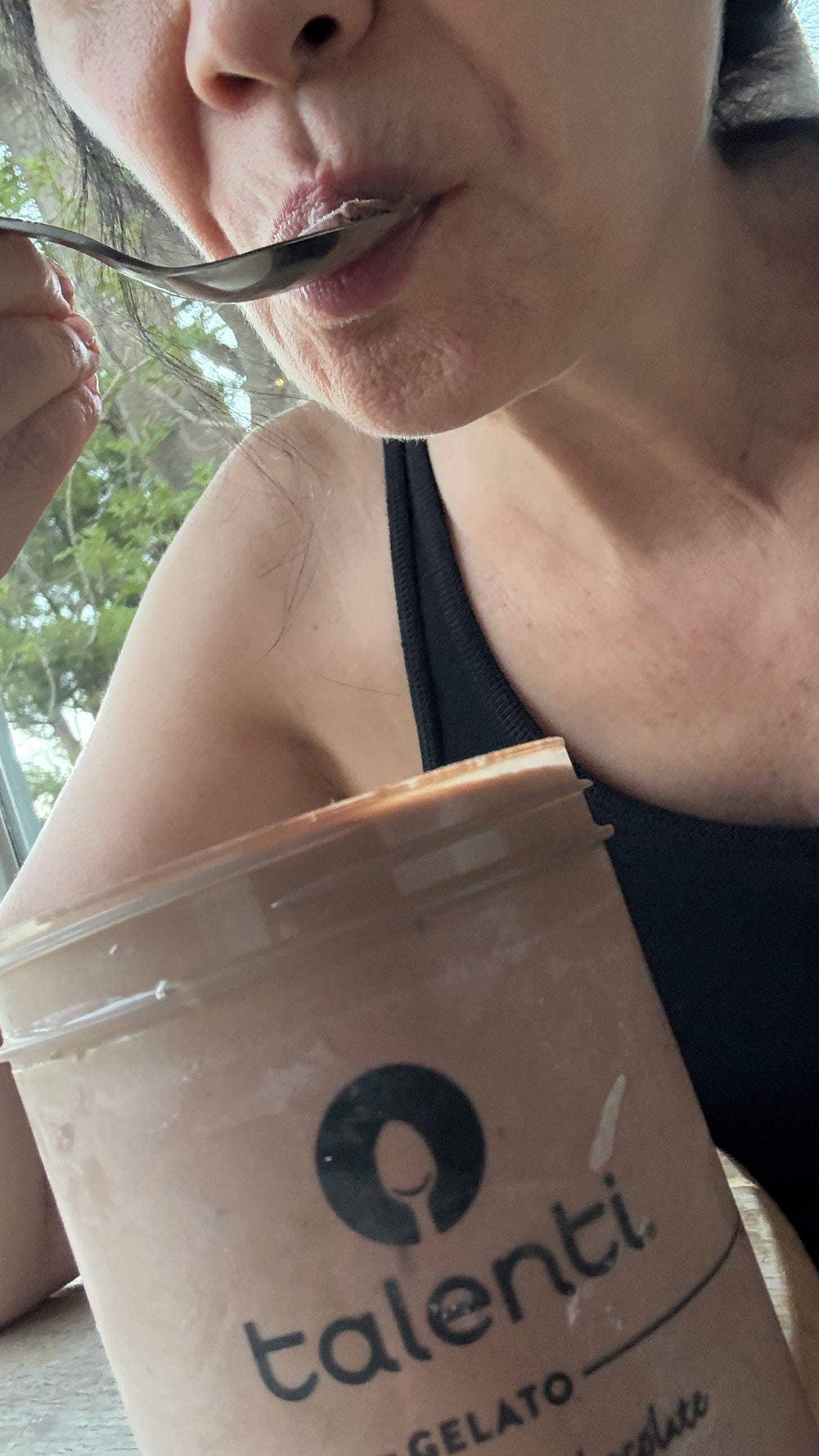 Laverne eating a spoonful of Talenti chocolate gelato