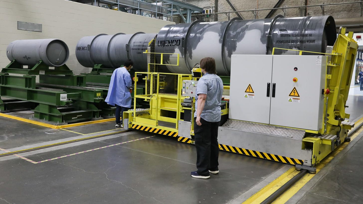 Employees at Urenco USA receive a cylinder of feed material for enrichment process.