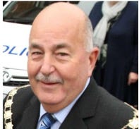 A person in a suit
Description automatically generated A person in a suit
Description automatically generated