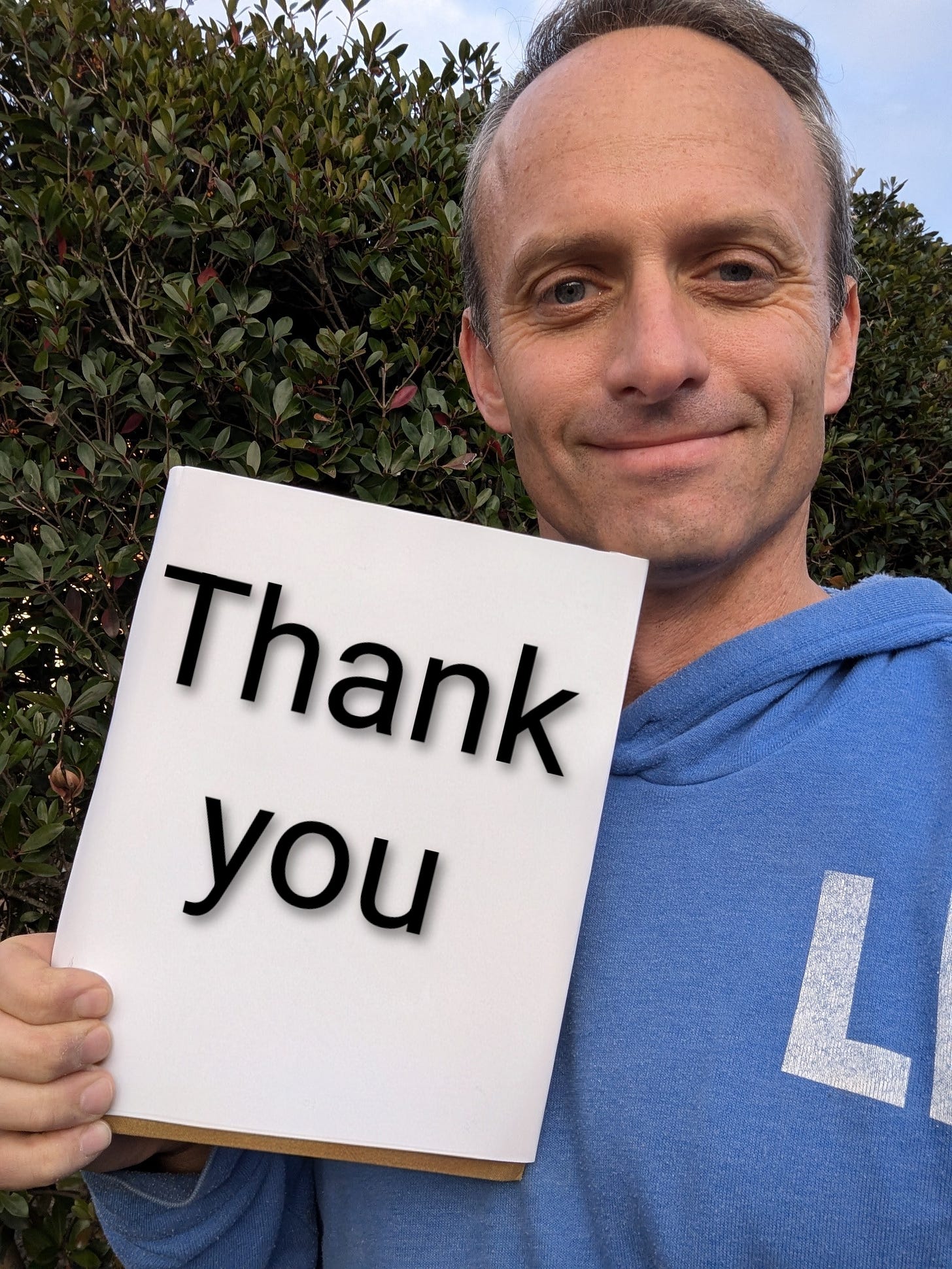 Stephen holds up a book that says "thank you." Stephen holds up a book that says "thank you."