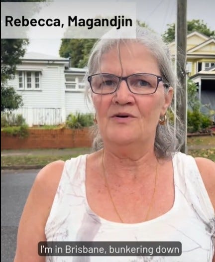 Photo of Rebecca speaking while standing on a Brisbane street Photo of Rebecca speaking while standing on a Brisbane street
