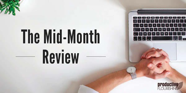Person with hands crossed on a computer. Text overlay: The Mid-Month Review